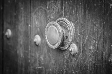 old doors close up view - knobs, design elements, architecture of the ancient doors within the streets of the spanish cities