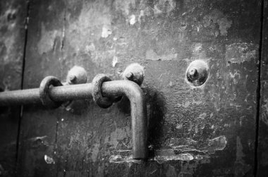 old doors close up view - knobs, design elements, architecture of the ancient doors within the streets of the spanish cities