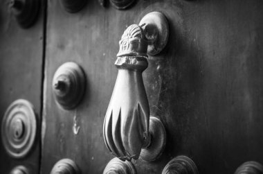 old doors close up view - knobs, design elements, architecture of the ancient doors within the streets of the spanish cities