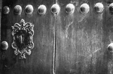old doors close up view - knobs, design elements, architecture of the ancient doors within the streets of the spanish cities