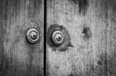 old doors close up view - knobs, design elements, architecture of the ancient doors within the streets of the spanish cities