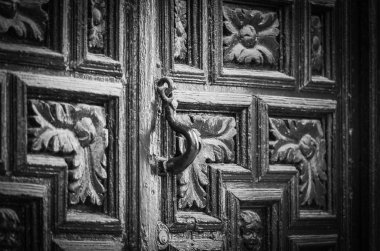 old doors close up view - knobs, design elements, architecture of the ancient doors within the streets of the spanish cities