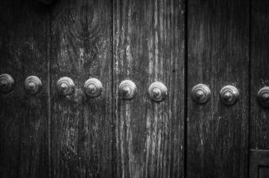 old doors close up view - knobs, design elements, architecture of the ancient doors within the streets of the spanish cities