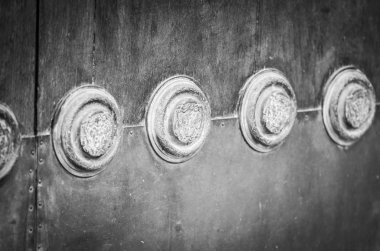 old doors close up view - knobs, design elements, architecture of the ancient doors within the streets of the spanish cities