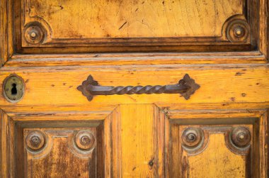 old doors close up view - knobs, design elements, architecture of the ancient doors within the streets of the spanish cities