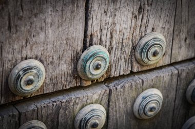 old doors close up view - knobs, design elements, architecture of the ancient doors within the streets of the spanish cities