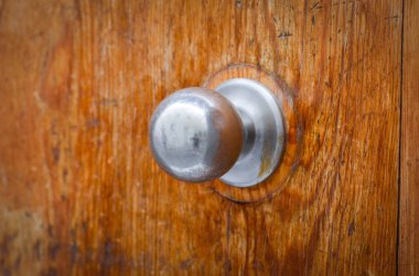 old doors close up view - knobs, design elements, architecture of the ancient doors within the streets of the spanish cities