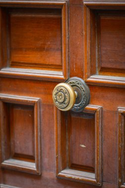 old doors close up view - knobs, design elements, architecture of the ancient doors within the streets of the spanish cities