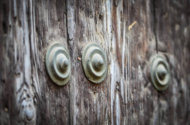 old doors close up view - knobs, design elements, architecture of the ancient doors within the streets of the spanish cities