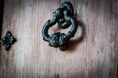 old doors close up view - knobs, design elements, architecture of the ancient doors within the streets of the spanish cities