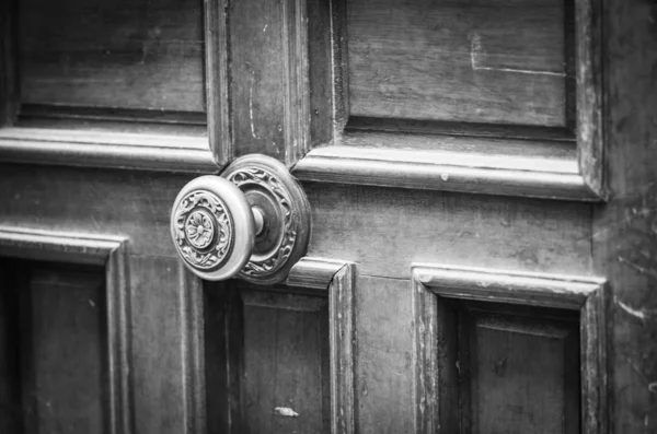old doors close up view - knobs, design elements, architecture of the ancient doors within the streets of the spanish cities