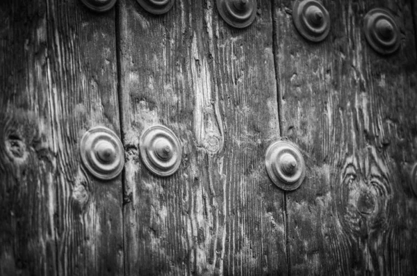 old doors close up view - knobs, design elements, architecture of the ancient doors within the streets of the spanish cities