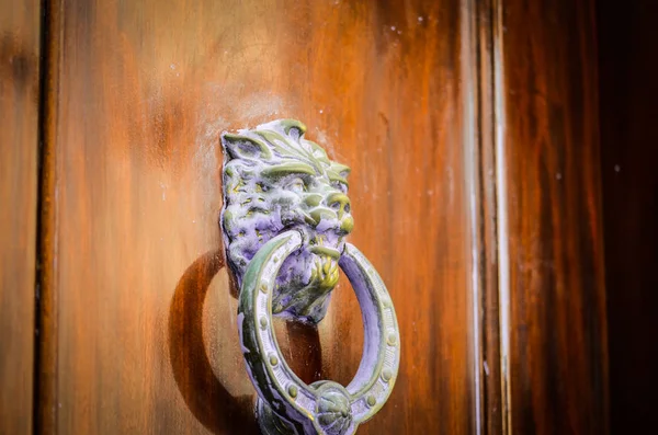 old doors close up view - knobs, design elements, architecture of the ancient doors within the streets of the spanish cities
