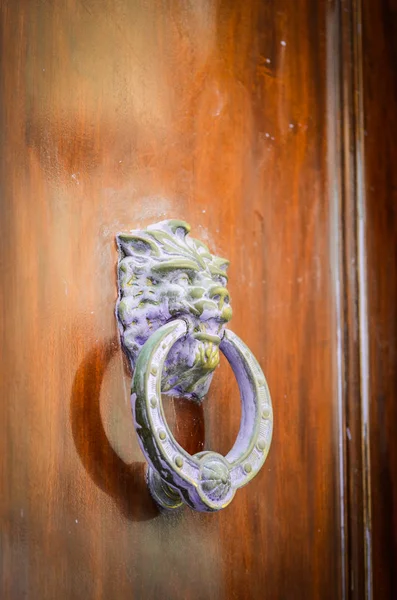 old doors close up view - knobs, design elements, architecture of the ancient doors within the streets of the spanish cities