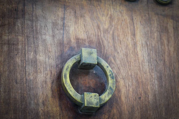 old doors close up view - knobs, design elements, architecture of the ancient doors within the streets of the spanish cities