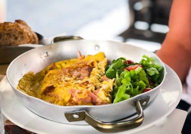 tasty breakfast omlette with fresh eggs, ham, mushrooms & cheese