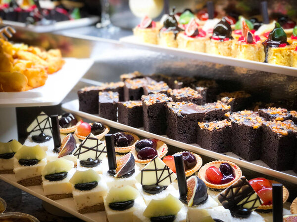 mix mini cakes & sweets with  fresh fruits & glazed topping