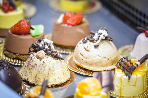 tasty mini cakes with fresh ingredients & fruits