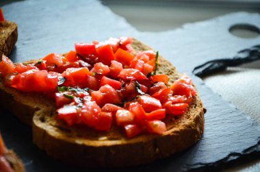 deliciouse tomatoes bruschetta with fresh basil