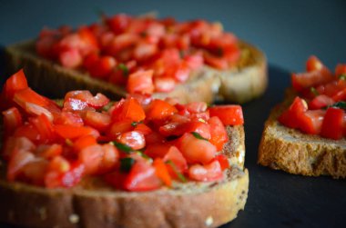 deliciouse tomatoes bruschetta with fresh basil
