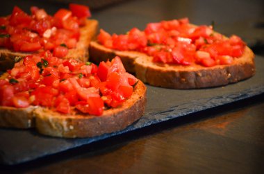 deliciouse tomatoes bruschetta with fresh basil