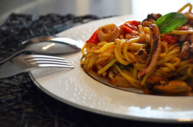 delicious seafood pasta with fresh vegetables & spices