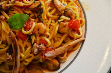 delicious seafood pasta with fresh vegetables & spices