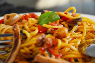 delicious seafood pasta with fresh vegetables & spices