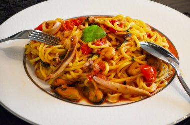 delicious seafood pasta with fresh vegetables & spices