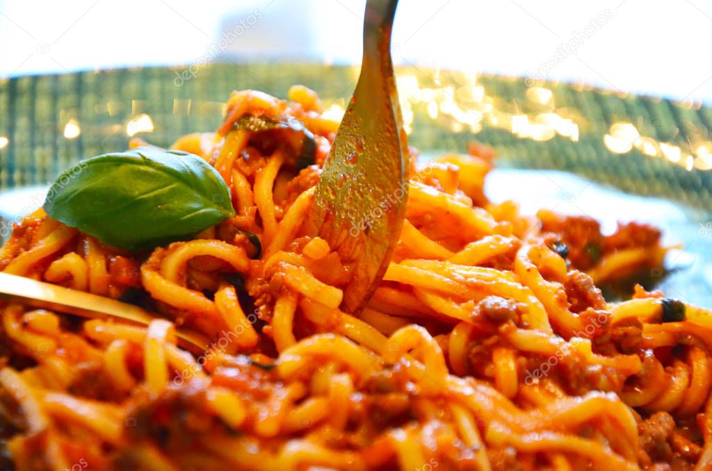 delicious italian bolognese spaghetti with fresh basil
