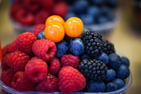 fresh berries close up - strawberries, blueberries, red berries, raspberry, black berries