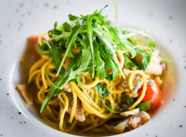 delicious fresh italian pasta with fish & rucola salad