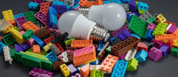 Light bulb and plastic blocks. Idea concept