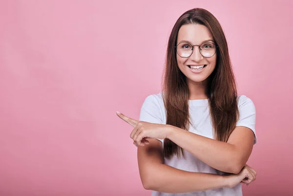 Attractive joyful girl in t-shirt and round pc glases with long hair — Stock Photo, Image