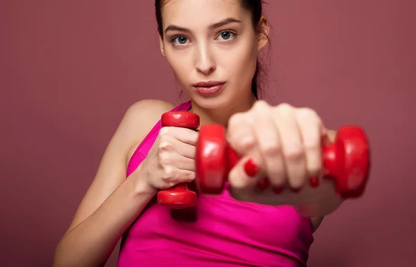White young lady working with dumbbells. — 스톡 사진