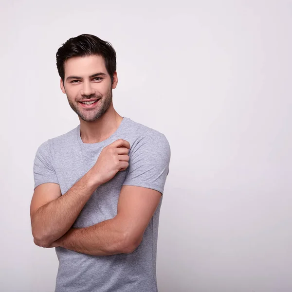 Sorrindo jovem branco cara com uma barba em um fundo branco . — Fotografia de Stock