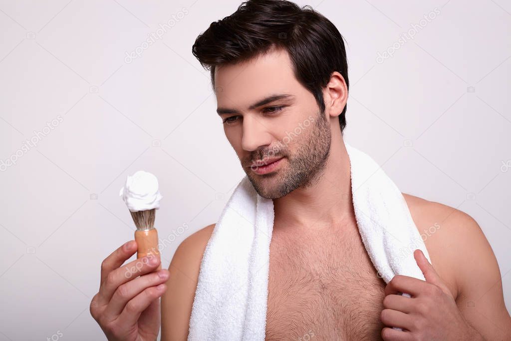 Close-up, Guy, shaving foam and razor.