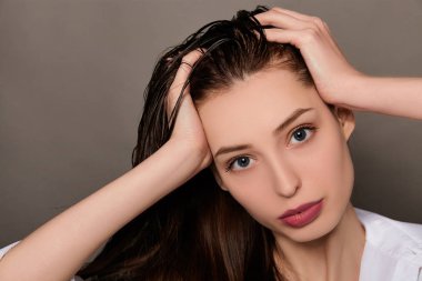 Close-up of a beautiful young brown-haired woman.