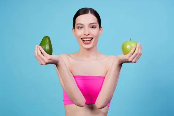Charming Beautiful Young Girl Sports Pink Top Holding Avocado Green — Stock Photo, Image