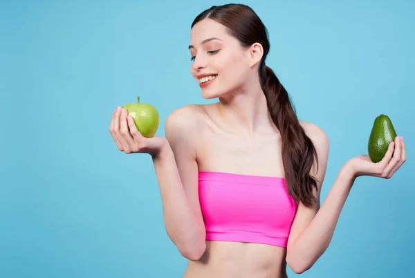 Attractive Athletic Young Girl Sports Pink Top Holds Avocado Green — Stock Photo, Image