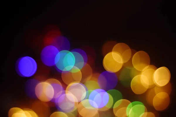 bright color spots on a dark background, colorful bokeh