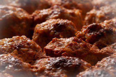 meat hedgehogs with rice in tomato sauce