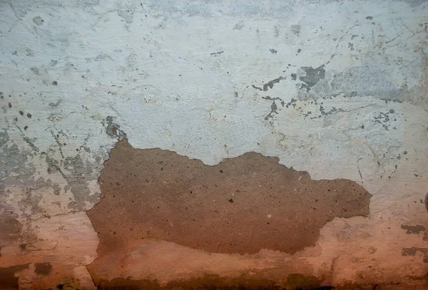 Textura da parede de pedra velha coberta com gesso branco — Fotografia de Stock