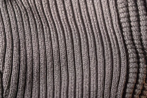 the texture of knitted clothes is gray