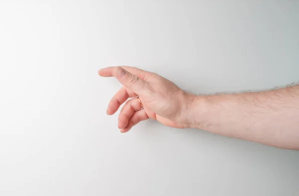 De rechter- en linkerhand van een persoon die iets probeert te bereiken of te grijpen. gooien, aanraken. Ik strek naar links. geïsoleerd op een witte achtergrond — Stockfoto