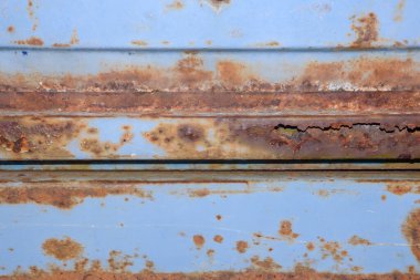 Paslı demir deseni ve kabuğu soyulmuş boya.