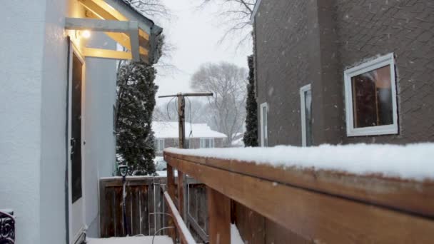 Snow Falling Suburban Backyard Porch Light Rail — Stock Video