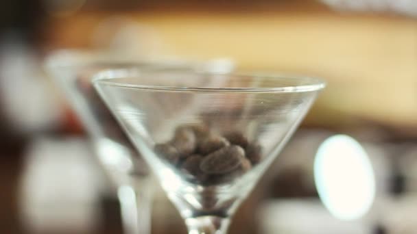 Rack Focus Martini Glass Filled Cocoa Beans — 비디오