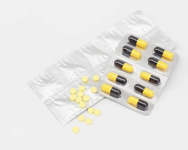 Panels of capsules on white background — Stock Photo, Image