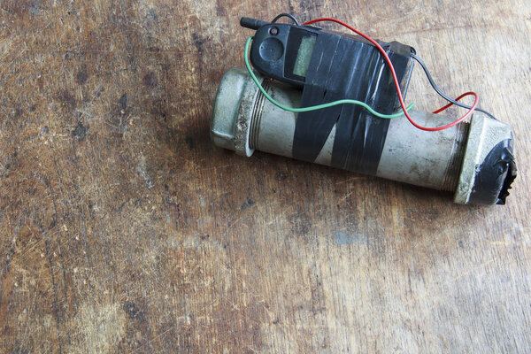 Steel pipe explosive (IED) is ignited by cell phone.